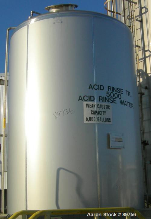 USED: Walker 5,000 gallon, type 304L stainless steel, storage tank. Vertical, dished heads. Approximate 8' diameter x 12' straight side. Misc top and side flanged openings. Bottom has a 2" center out...