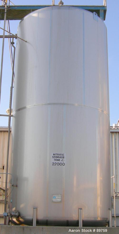USED: Walker 21,000 gallon, type 304L stainless steel, storage tank. Vertical, dished heads, approximate 12' diameter x 24' straight side. Top openings include an 18" manway with bolt-on cover, 2" fl...