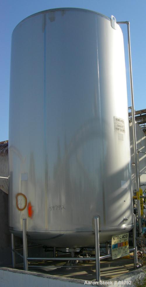 USED: Walker 10,000 gallon, type 316L stainless steel, storage tank. Vertical, dished heads. Approximate 9'6" diameter x 16' straight side. Misc top and side flanged openings. Side openings include a...