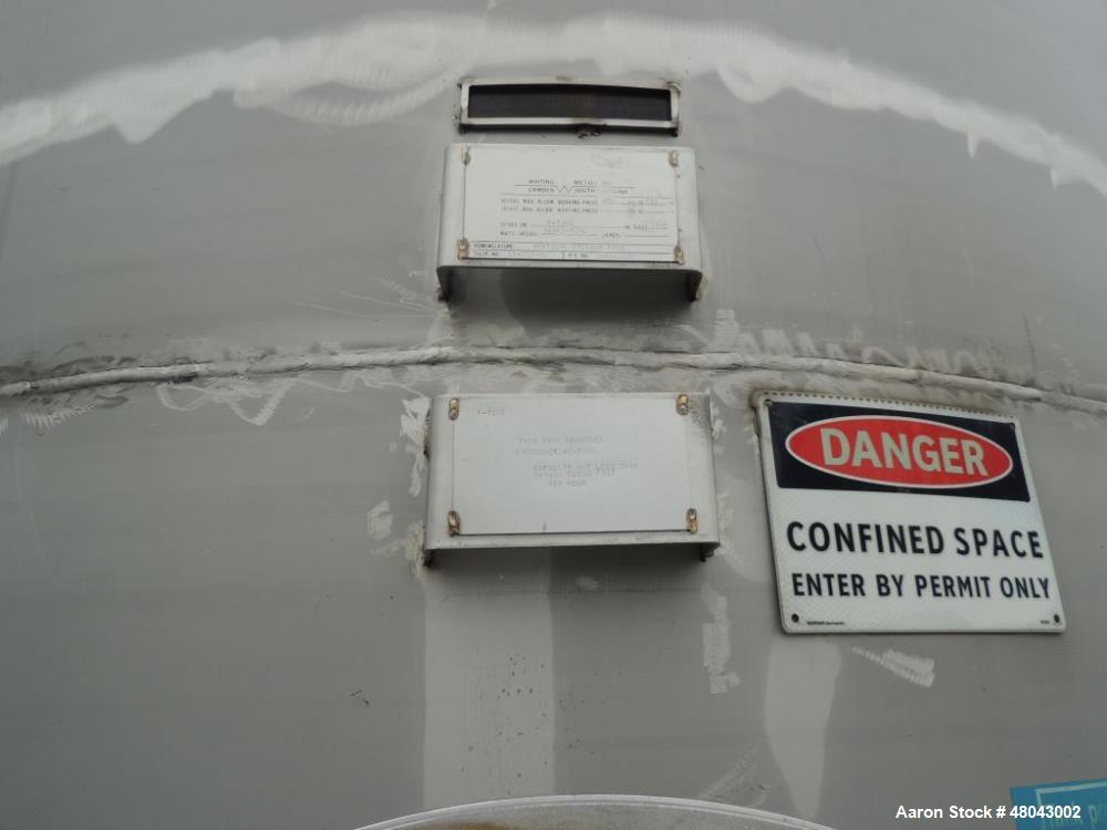 Used Whiting Metals 6,500 gal 316L Stainless Steel Vertical Tank.  Rated ATM @ 150 F. Dimensions:  8'dia x 21'h.  Flat bottom. Serial # F-7069. Built 1996.