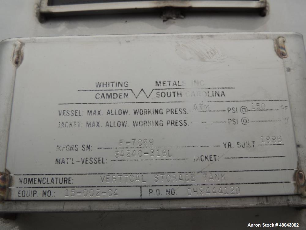 Used Whiting Metals 6,500 gal 316L Stainless Steel Vertical Tank.  Rated ATM @ 150 F. Dimensions:  8'dia x 21'h.  Flat bottom. Serial # F-7069. Built 1996.