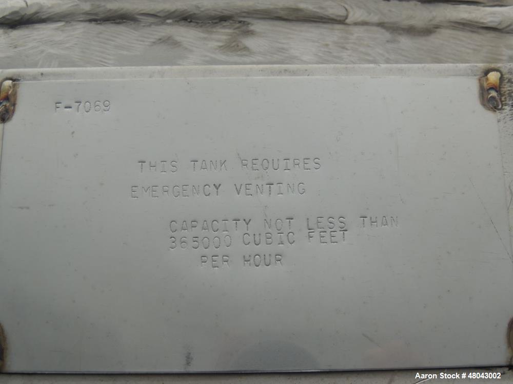 Used Whiting Metals 6,500 gal 316L Stainless Steel Vertical Tank.  Rated ATM @ 150 F. Dimensions:  8'dia x 21'h.  Flat bottom. Serial # F-7069. Built 1996.