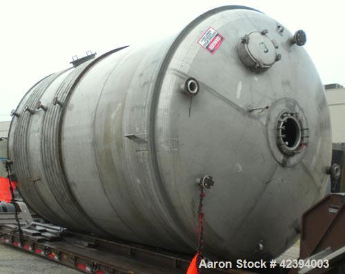 Used Wolfe Mechanical and Equipment Tank, 14,000 gallon, 304L stainless steel, vertical. Approximately 144" diameter x 192" straight side, dished top, sloped bottom. Internal rated 5 psi at 150 deg F...