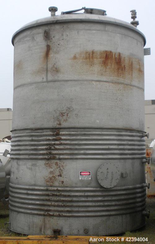 Used Wolfe Mechanical and Equipment Tank, 14,000 gallon, 304L stainless steel, vertical. Approximately 144" diameter x 192" straight side, dished top, sloped bottom. Internal rated 5 psi at 150 deg F...