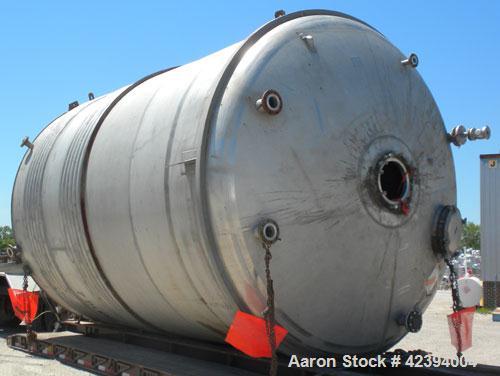 Used Wolfe Mechanical and Equipment Tank, 14,000 gallon, 304L stainless steel, vertical. Approximately 144" diameter x 192" straight side, dished top, sloped bottom. Internal rated 5 psi at 150 deg F...