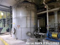 Used 11,000 Gallon 316 Stainless Steel Vertical Tank. Approximately 12' diameter x 13' tall. Side manway. Flat top.
