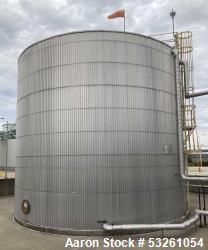 Used Approximate 216,000 gallons Stainless Steel Storage Tank With Philadelphia 40 HP Side Mount Agitator. T-1010. Flat top ...