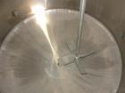 Used 6000 Gallon 304 Stainless Steel Vertical Tank with Dished Heads on Six Legs. Tank is 120