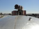 Used 6000 Gallon 304 Stainless Steel Vertical Tank with Dished Heads on Six Legs. Tank is 120