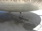 Used 6000 Gallon 304 Stainless Steel Vertical Tank with Dished Heads on Six Legs. Tank is 120