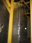 Used Approximate 10,000 gallon vertical 304 stainless steel tank. 11' Diameter x 15' straight side. With flat top and slope bottom heads.