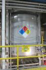 Used approximately 10,500 gallon 316L stainless steel vertical storage tank. 12 diameter X 124