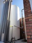 Used 20,000 Gallon Jacketed Silo, mild steel exterior and stainless steel interior. Jacket coils are located in the bottom 1/3 of the tank. 7 1/2 hp, 240/480V, 60 hz. Agitator mounted at bottom side ...