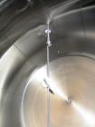Used 5,000 Gallon Mild Steel Exterior/Stainless Steel Tank. Interior previously used to store sweeteners. End manway, sight glass. Overall Dims- 10'3