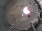 Used: Hammond Iron Works Tank, 15,000 gallon, 316 stainless steel, 11' diameter x 21' high, vertical.  Cone top and flat bottom. Insulated.  This tank has an API rating for outside storage.  MFRS. A....