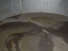 Used: Tank, approximately 12,000 gallon, stainless steel, vertical top mounted Lightnin agitator. (Service tank CP46, ammonia sulphate.)