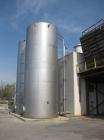Used 25,000 Gallon 304 Stainless Steel Vertical Storage Tank. Approximate 11' 10