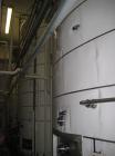 Used Tank, Price-Schonstrom, 16,500  gallon, stainless steel. 12' diameter x 20' high, dished heads, internal rated 20 psi @ 100 deg F, dimple jacket rated 50 psi @ 100 deg F.  Insulated with plastic...