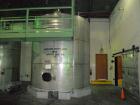 Used Saracco Tank & Mfg Approximately 10,000 Gallon Stainless Steel Storage Tank. Approximately 12' diameter x 12' straight side. Flat bottom and slight cone top. Various top openings including a 17