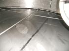 Used Saracco Tank & Mfg Approximately 10,000 Gallon Stainless Steel Storage Tank. Approximately 12' diameter x 12' straight side. Flat bottom and slight cone top. Various top openings including a 17