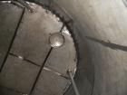 Used Saracco Tank & Mfg Approximately 10,000 Gallon Stainless Steel Storage Tank. Approximately 12' diameter x 12' straight side. Flat bottom and slight cone top. Various top openings including a 17