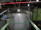 Used Saracco Tank & Mfg Approximately 5,200 Gallon Stainless Steel Storage Tank. Approximately 9' diameter x 11' straight side. Flat bottom and slight cone top. Various top openings including a 17