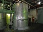 Used Saracco Tank & Mfg Approximately 5,200 Gallon Stainless Steel Storage Tank. Approximately 9' diameter x 11' straight side. Flat bottom and slight cone top. Various top openings including a 17