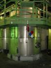 Used Krenz Approximately 5,200 Gallon Stainless Steel Storage Tank. Approximately 9' diameter x 11' straight side. Flat bottom and slight cone top. Various top openings including a 17
