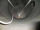 Used Krenz Approximately 5,200 Gallon Stainless Steel Storage Tank. Approximately 9' diameter x 11' straight side. Flat bottom and slight cone top. Various top openings including a 17