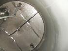 Used Krenz Approximately 5,200 Gallon Stainless Steel Storage Tank. Approximately 9' diameter x 11' straight side. Flat bottom and slight cone top. Various top openings including a 17