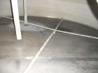 Used Krenz Approximately 5,200 Gallon Stainless Steel Storage Tank. Approximately 9' diameter x 11' straight side. Flat bottom and slight cone top. Various top openings including a 17