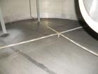 Used Krenz Approximately 5,200 Gallon Stainless Steel Storage Tank. Approximately 9' diameter x 11' straight side. Flat bottom and slight cone top. Various top openings including a 17