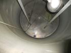 Used Krenz Approximately 5,200 Gallon Stainless Steel Storage Tank. Approximately 9' diameter x 11' straight side. Flat bottom and slight cone top. Various top openings including a 17
