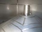 Used 7,200 Gallon Stainless Steel Tank. Approximately 14' tall (with stands approximately 17'), 10' diameter, 2 x 4ft. jackets for glycol / coolant. Cooling channels built into floor. Inverted cone f...