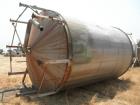 Used Tank, Approximate 12,000 Gallon, Stainless Steel tank, Vertical. Approximately 11' diameter x 16' straight side, cone top with 2” diameter center top opening, 20” diameter top manway and 4” diam...