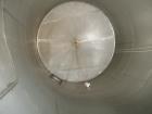 Used Tank, Approximate 12,000 Gallon, Stainless Steel tank, Vertical. Approximately 11' diameter x 16' straight side, cone top with 2” diameter center top opening, 20” diameter top manway and 4” diam...