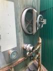 Used Tank, Approximate 12,000 Gallon, Stainless Steel tank, Vertical. Approximately 11' diameter x 16' straight side, cone top with 2” diameter center top opening, 20” diameter top manway and 4” diam...