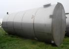 Used Tank, 20,000 Gallon, Stainless Steel, Vertical. Approximately 11-1/2' diameter x  25' high, cone top and flat bottom. Top head openings: 6