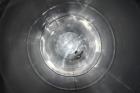 Used Tank, Approximate 19,500 Gallon, 14 Gauge Stainless steel, Vertical. Approximate 130” diameter x 336” straight side, coned top, 7” sloped bottom. Openings top 16” man way with cover and approxim...