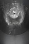 Used Tank, Approximate 19,500 Gallon, 14 Gauge Stainless steel, Vertical. Approximate 130” diameter x 336” straight side, coned top, 7” sloped bottom. Openings top 16” man way with cover and approxim...