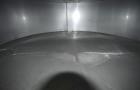 Used Tank, Approximate 19,500 Gallon, 14 Gauge Stainless steel, Vertical. Approximate 130” diameter x 336” straight side, coned top, 7” sloped bottom. Openings top 16” man way with cover and approxim...