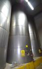 Used Tank, Approximate 19,500 Gallon, 14 Gauge Stainless steel, Vertical. Approximate 130” diameter x 336” straight side, coned top, 7” sloped bottom. Openings top 16” man way with cover and approxim...