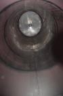 Used Tank, Approximate 19,500 Gallon, 14 Gauge Stainless steel, Vertical. Approximate 130” diameter x 336” straight side, coned top, 7” sloped bottom. Openings top 16” man way with cover and approxim...