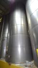 Used Tank, Approximate 19,500 Gallon, 14 Gauge Stainless steel, Vertical. Approximate 130” diameter x 336” straight side, coned top, 7” sloped bottom. Openings top 16” man way with cover and approxim...