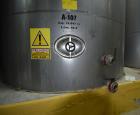 Used Tank, Approximate 19,500 Gallon, 14 Gauge Stainless steel, Vertical. Approximate 130” diameter x 336” straight side, coned top, 7” sloped bottom. Openings top 16” man way with cover and approxim...