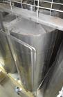Used Tank, Approximate 19,500 Gallon, 14 Gauge Stainless steel, Vertical. Approximate 130” diameter x 336” straight side, coned top, 7” sloped bottom. Openings top 16” man way with cover and approxim...