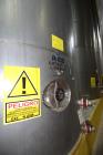 Used Tank, Approximate 19,500 Gallon, 14 Gauge Stainless steel, Vertical. Approximate 130” diameter x 336” straight side, coned top, 7” sloped bottom. Openings top 16” man way with cover and approxim...