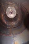 Used Tank, Approximate 19,500 Gallon, 14 Gauge Stainless steel, Vertical. Approximate 130” diameter x 336” straight side, coned top, 7” sloped bottom. Openings top 16” man way with cover and approxim...