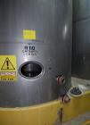 Used Tank, Approximate 19,500 Gallon, 14 Gauge Stainless steel, Vertical. Approximate 130” diameter x 336” straight side, coned top, 7” sloped bottom. Openings top 16” man way with cover and approxim...