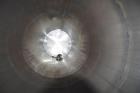 Used Tank, Approximate 19,500 Gallon, 14 Gauge Stainless steel, Vertical. Approximate 130” diameter x 336” straight side, coned top, 7” sloped bottom. Openings top 16” man way with cover and approxim...